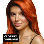 Woman with vibrant copper hair and text 'Glossify Your Hue' on a white background