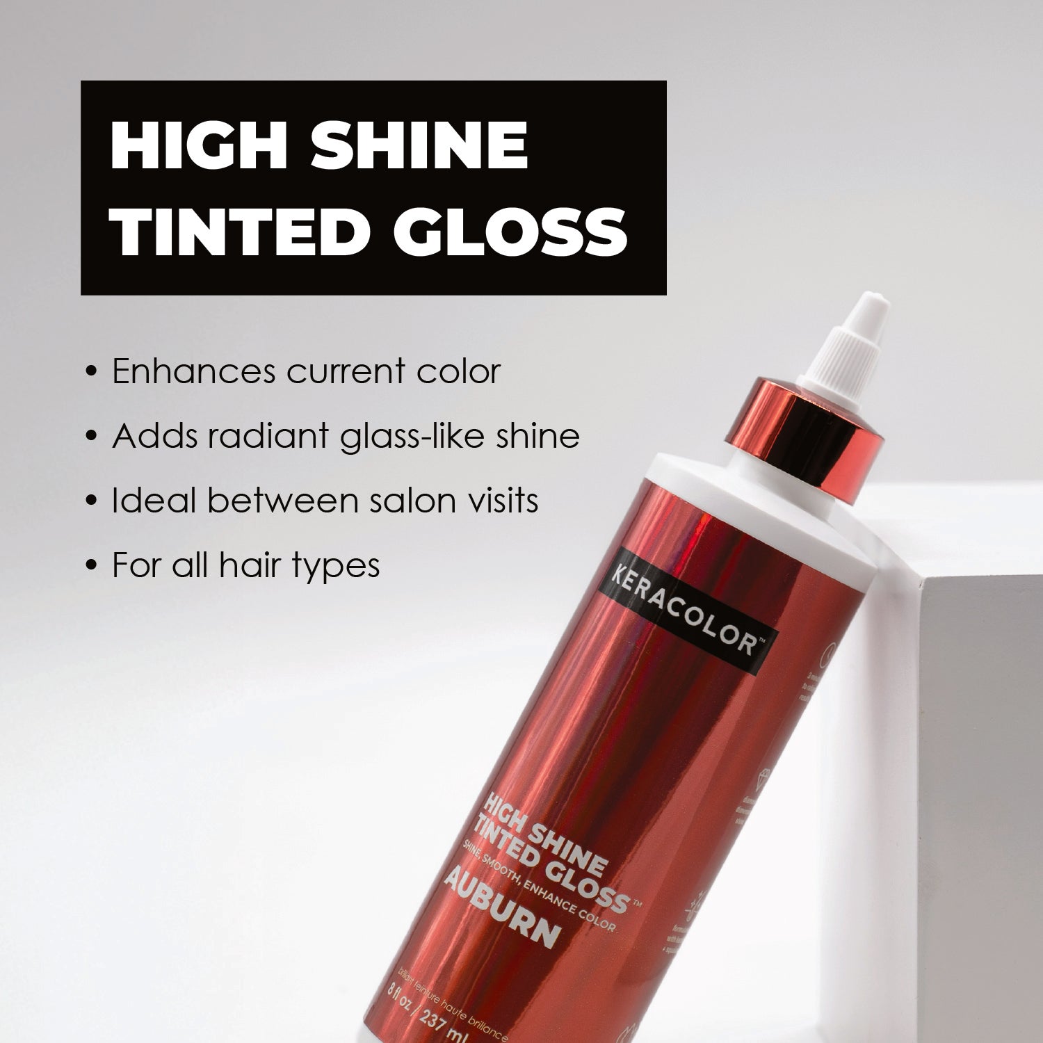 Red hair gloss bottle with text on a light gray background