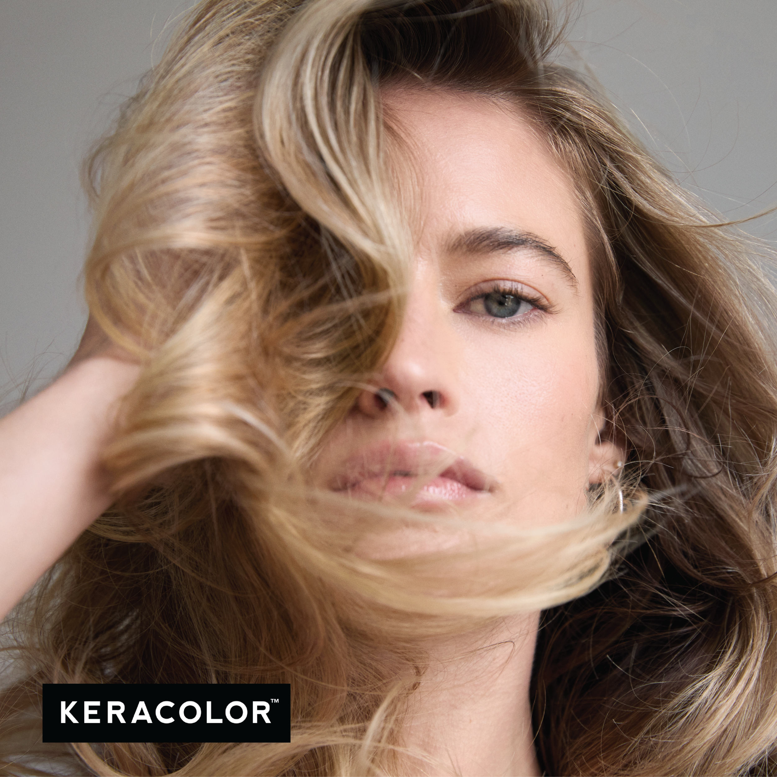 Woman with blonde hair blowing in the wind, with Keracolor logo.