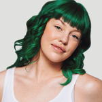 Woman with vibrant green hair and a white tank top against a plain background