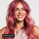Woman with pink hair smiling against a light background, Keracolor logo visible