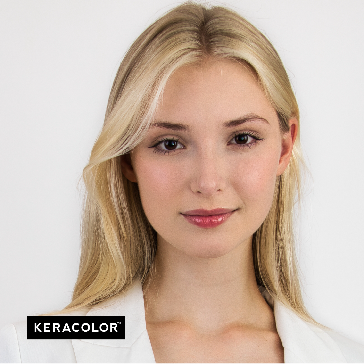 Woman with blonde hair and a white shirt, featuring Keracolor branding.