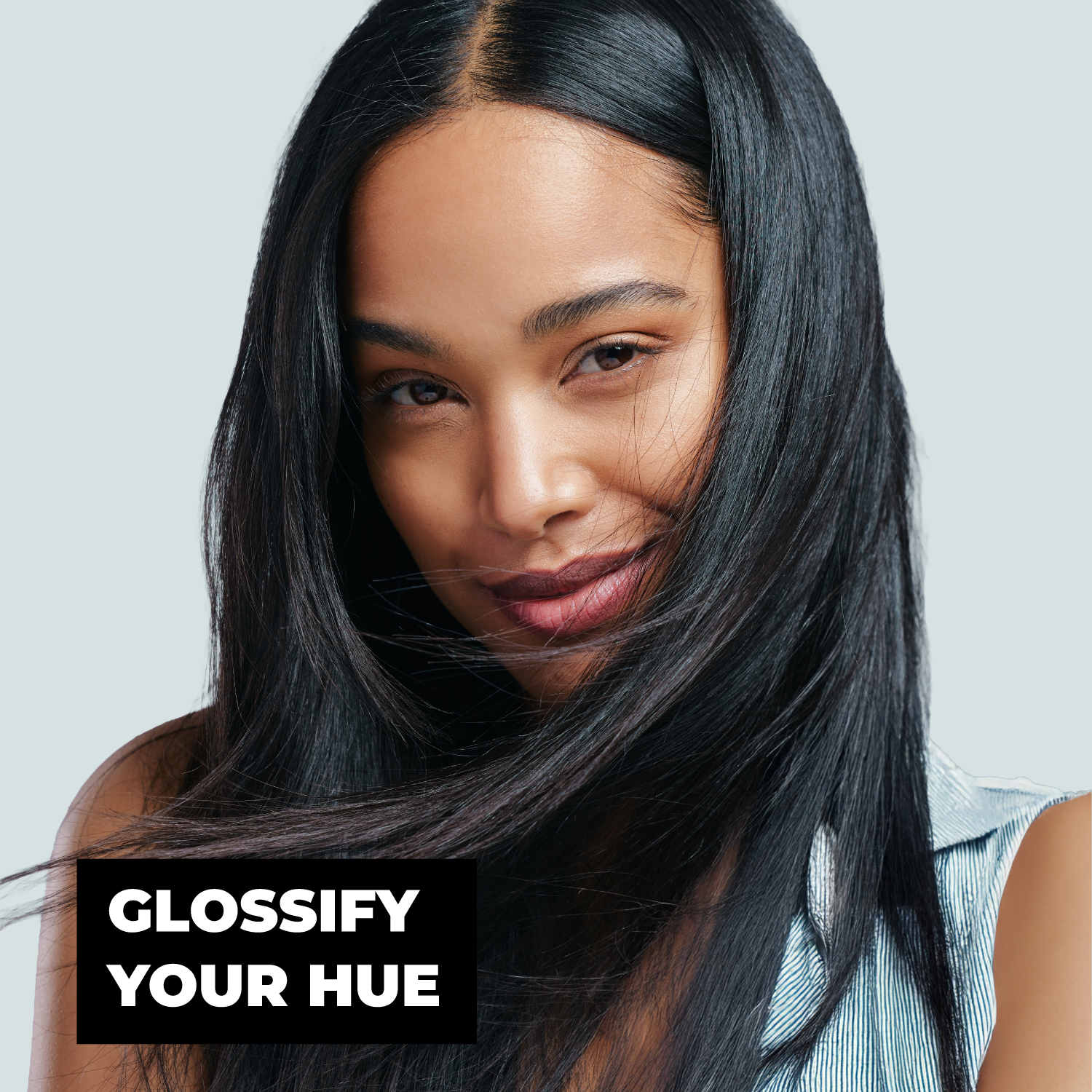 Woman with long black hair against a light gray background with text 'Glossify Your Hue'.